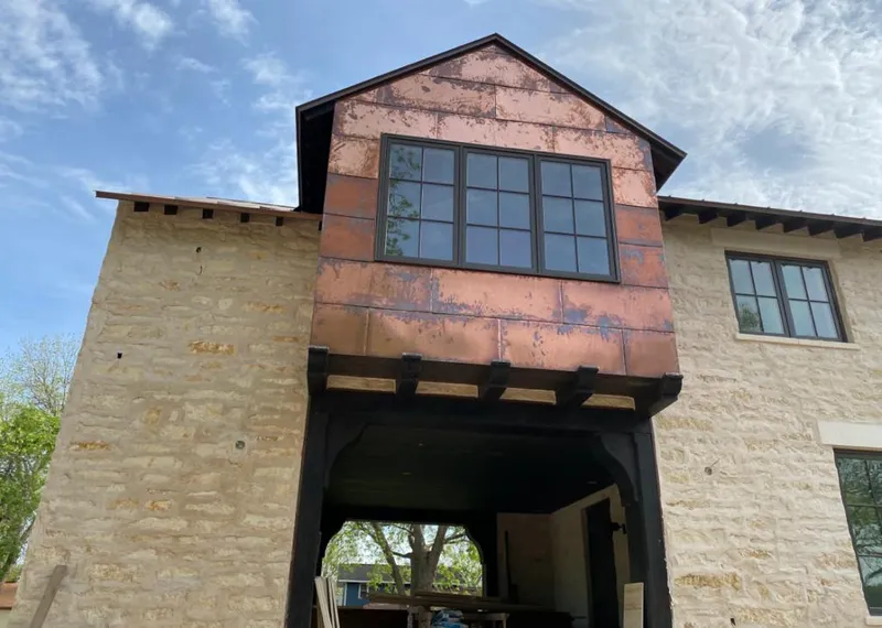 Copper metal panel facade on a stone building for Skylight Installation in Miami Springs