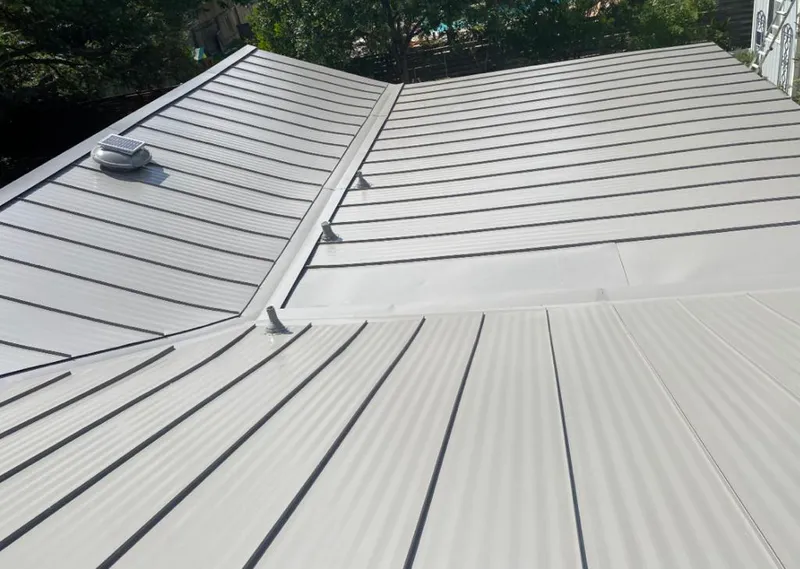 Solar attic fan installed on a metal roof for Roof Ventilation in Miami Springs